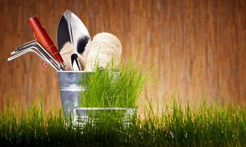 Trained gardeners using safe practices during outdoor maintenance